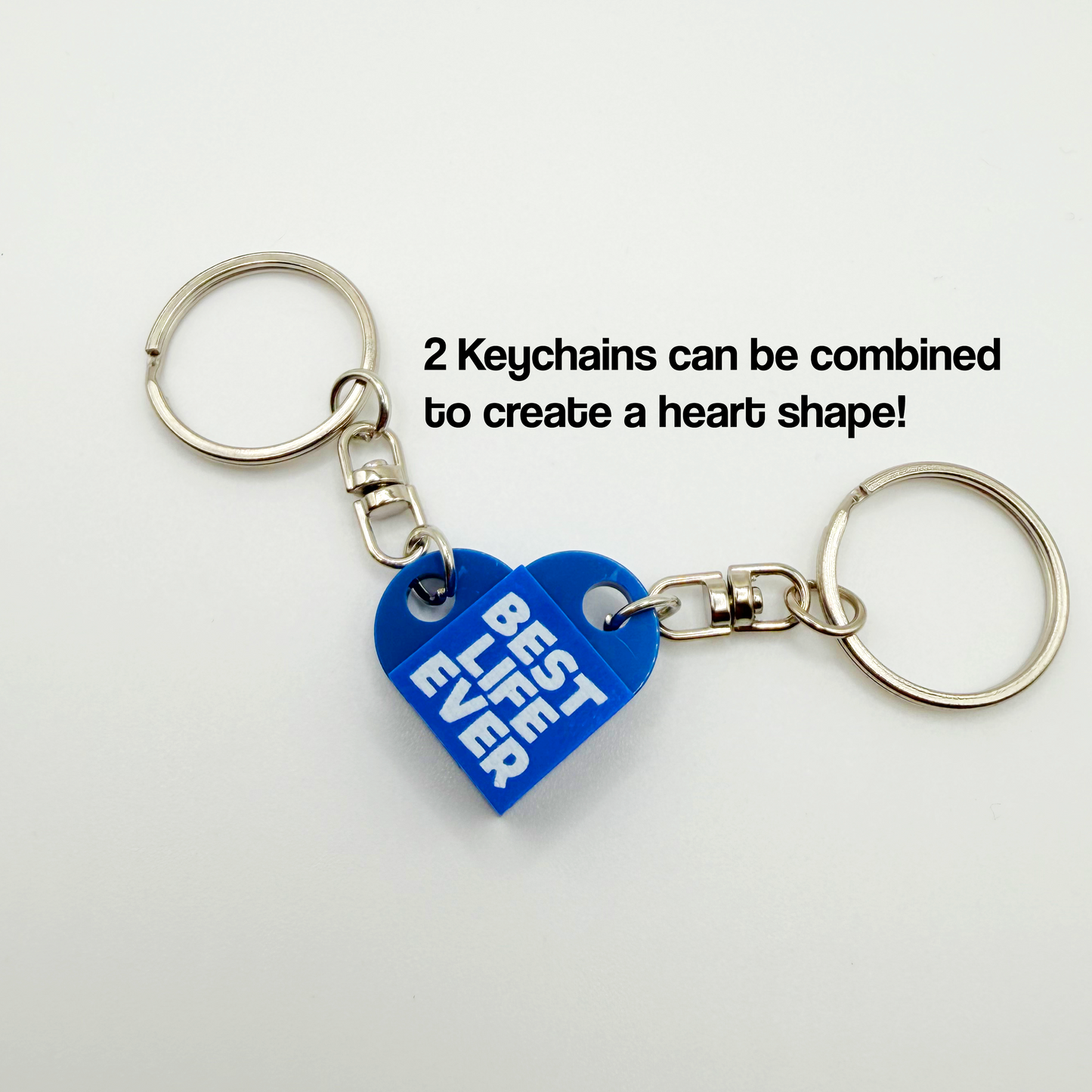 Blue heart-shaped keychain with 'Best Life Ever' text on a white background