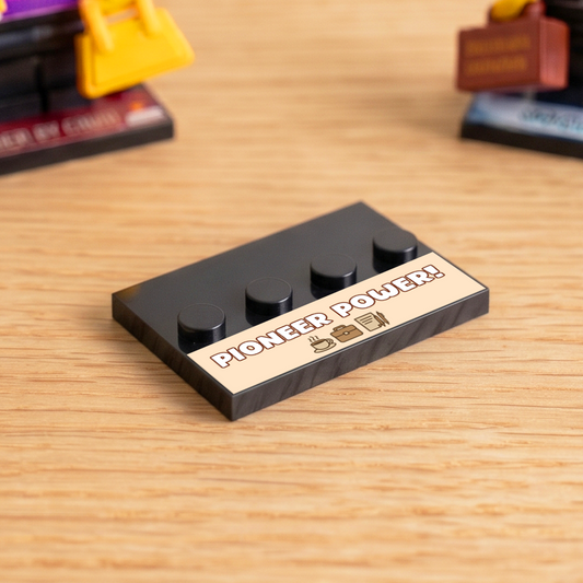 Black brick figure display stand with a 'Pioneer Power' decal